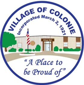 Seal of Village of Colonie showing Village Hall building, flag, trees, and motto 'A Place to be Proud of'.