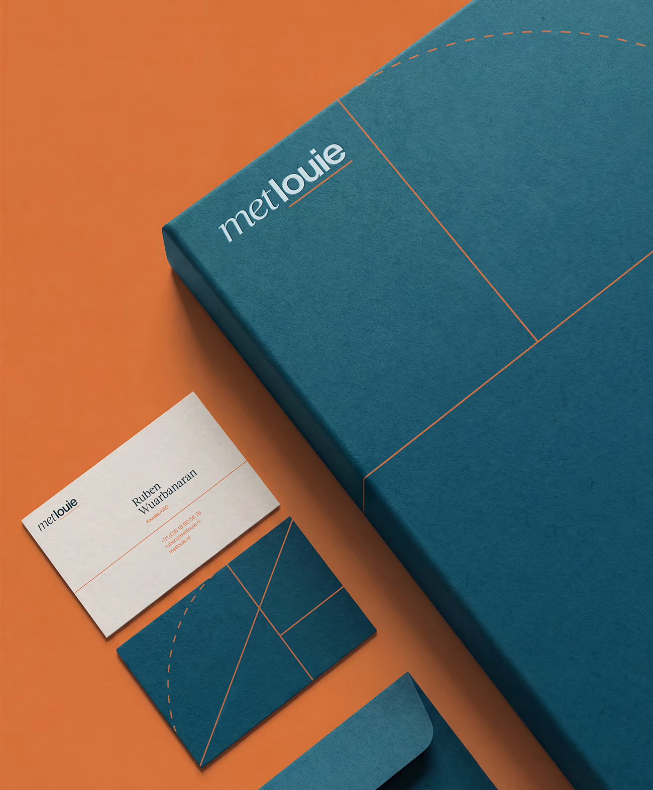 Blue stationery set on orange background featuring a box, business cards, and envelope with orange geometric lines and metlouie branding.
