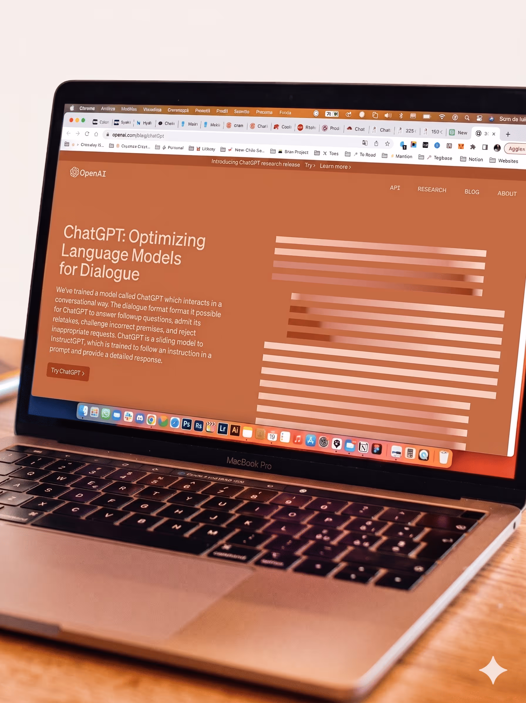 MacBook Pro displaying OpenAI's webpage about ChatGPT optimizing language models for dialogue.