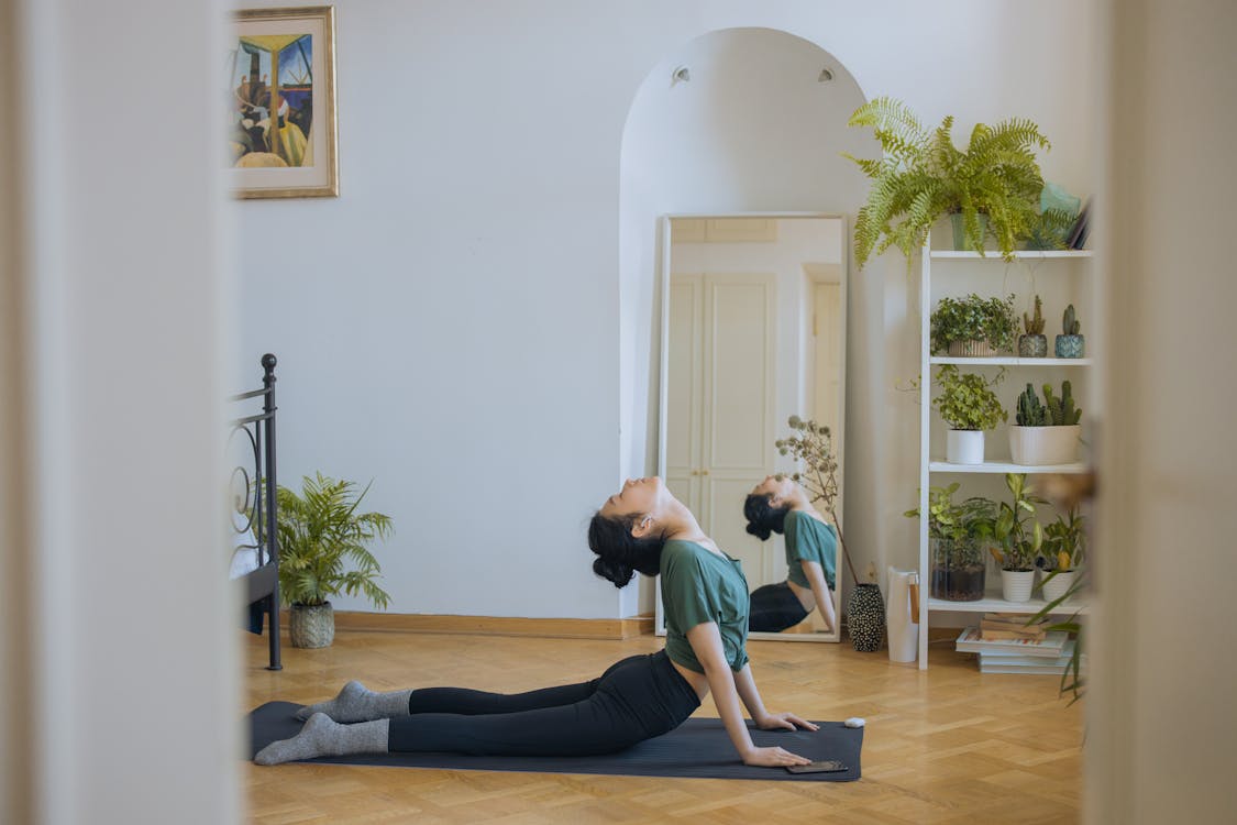 Free A Woman Doing Exercise at Home Stock Photo
