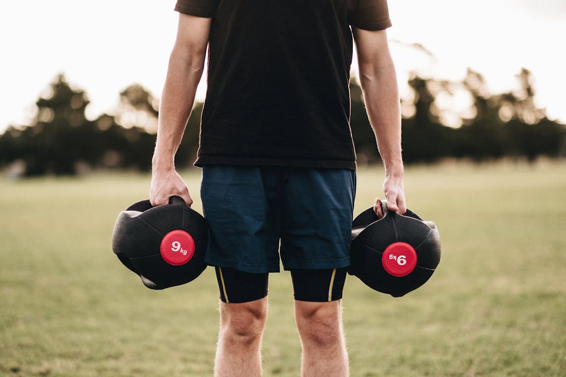 Free Person Holding Black Dumbbells Stock Photo