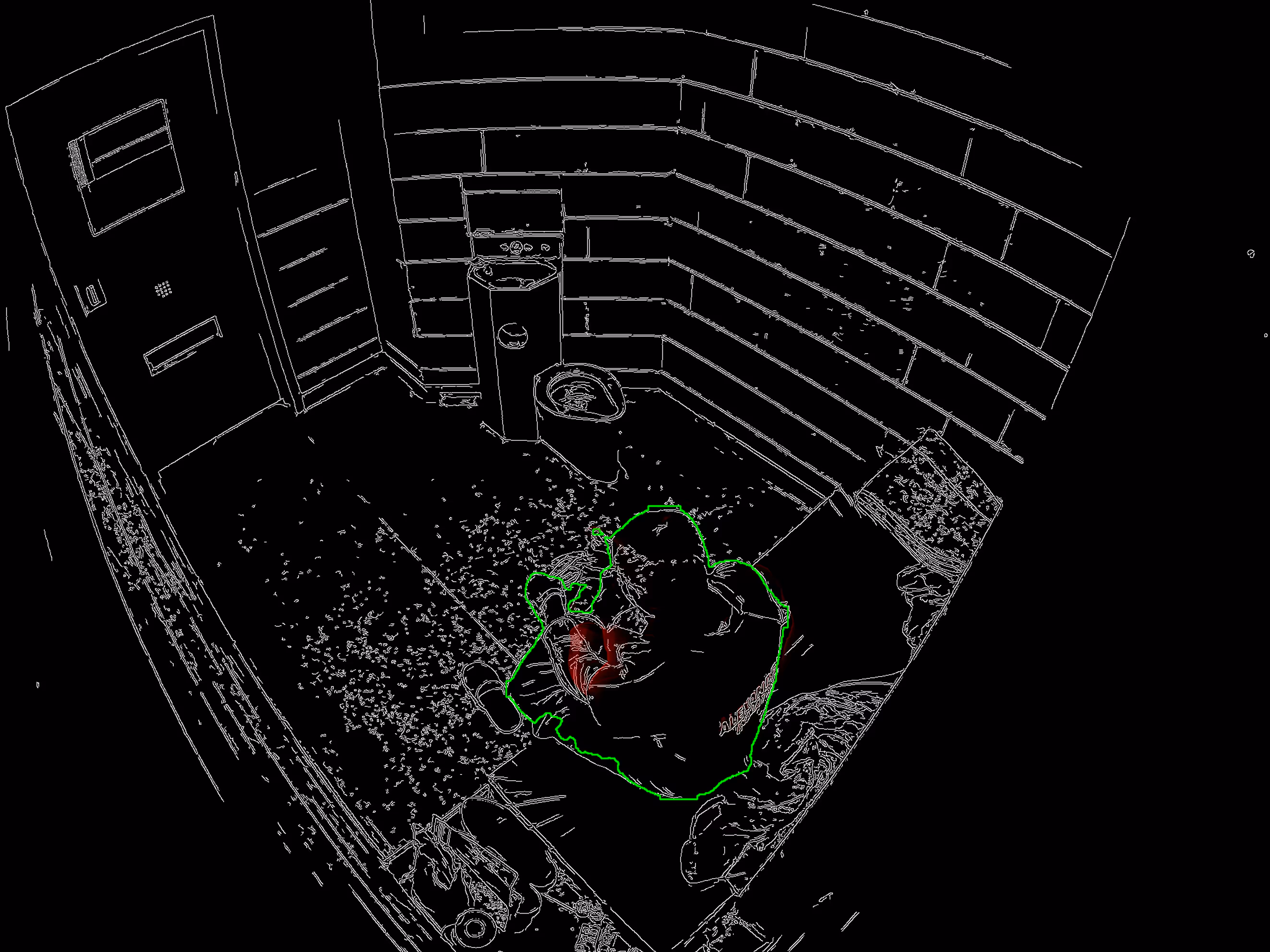 Person sitting on a bench inside a small cell with a toilet and sink.