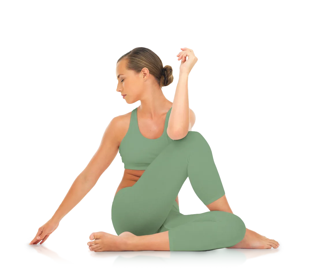 Woman in green athletic wear performing seated spinal twist yoga pose with eyes closed.