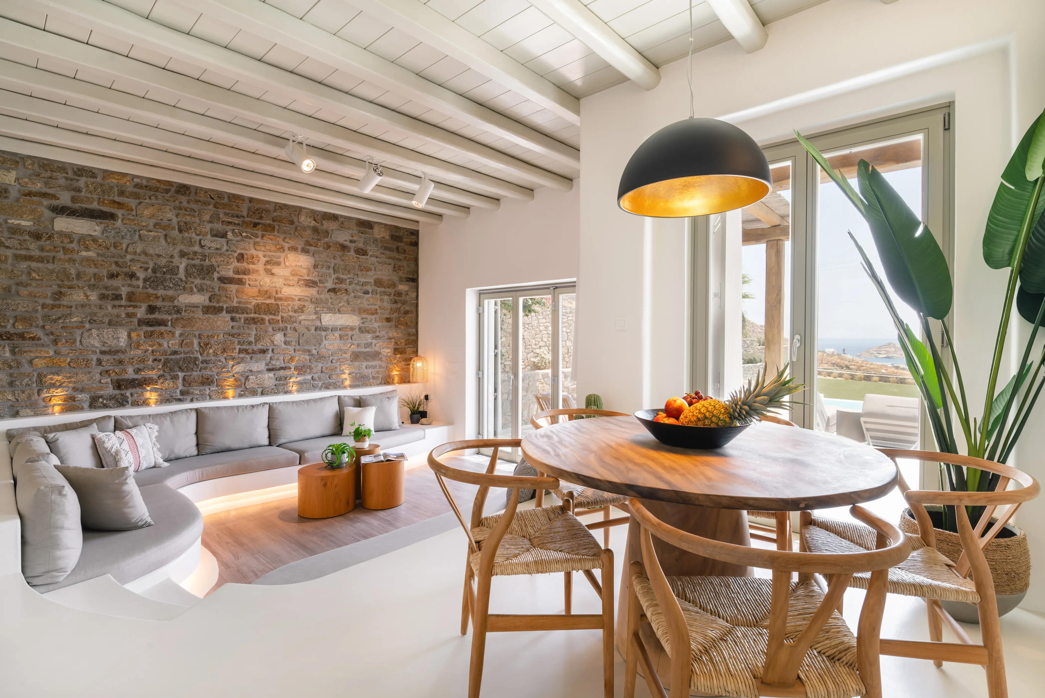 A round wooden table in a living room.