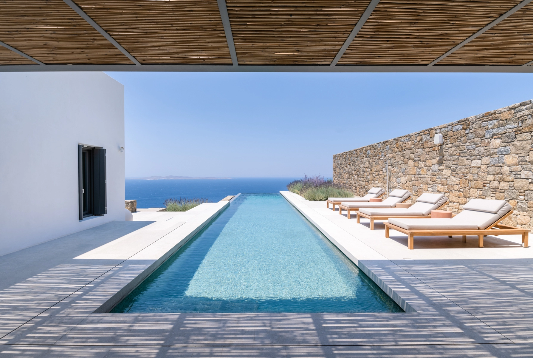 A swimming pool with a view of the sea.