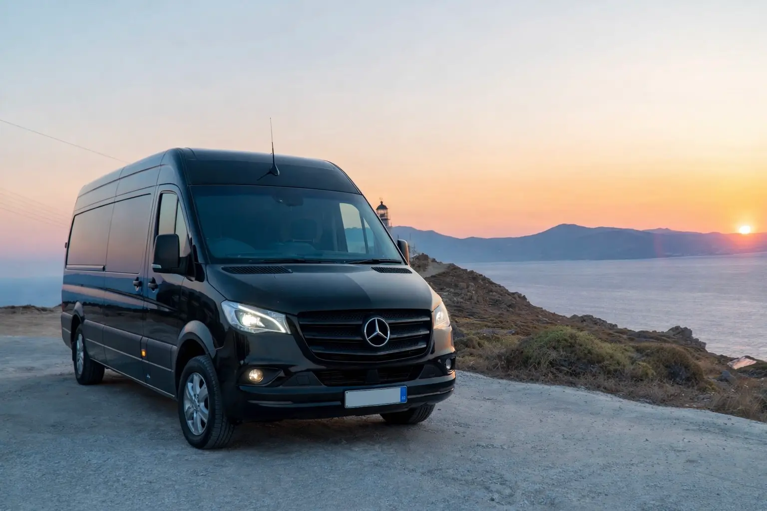 A black van in front of the sunset.
