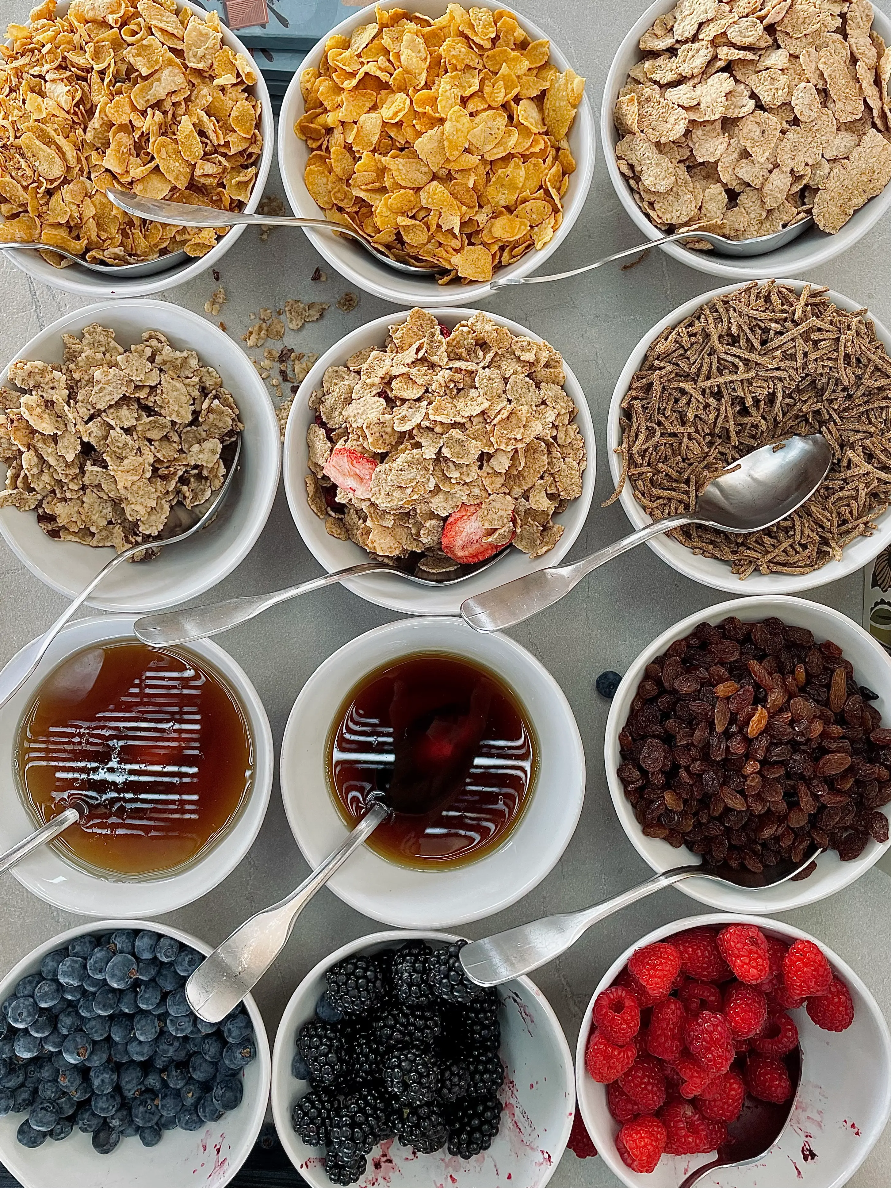 Half a dozen of bowls with different foods in them.
