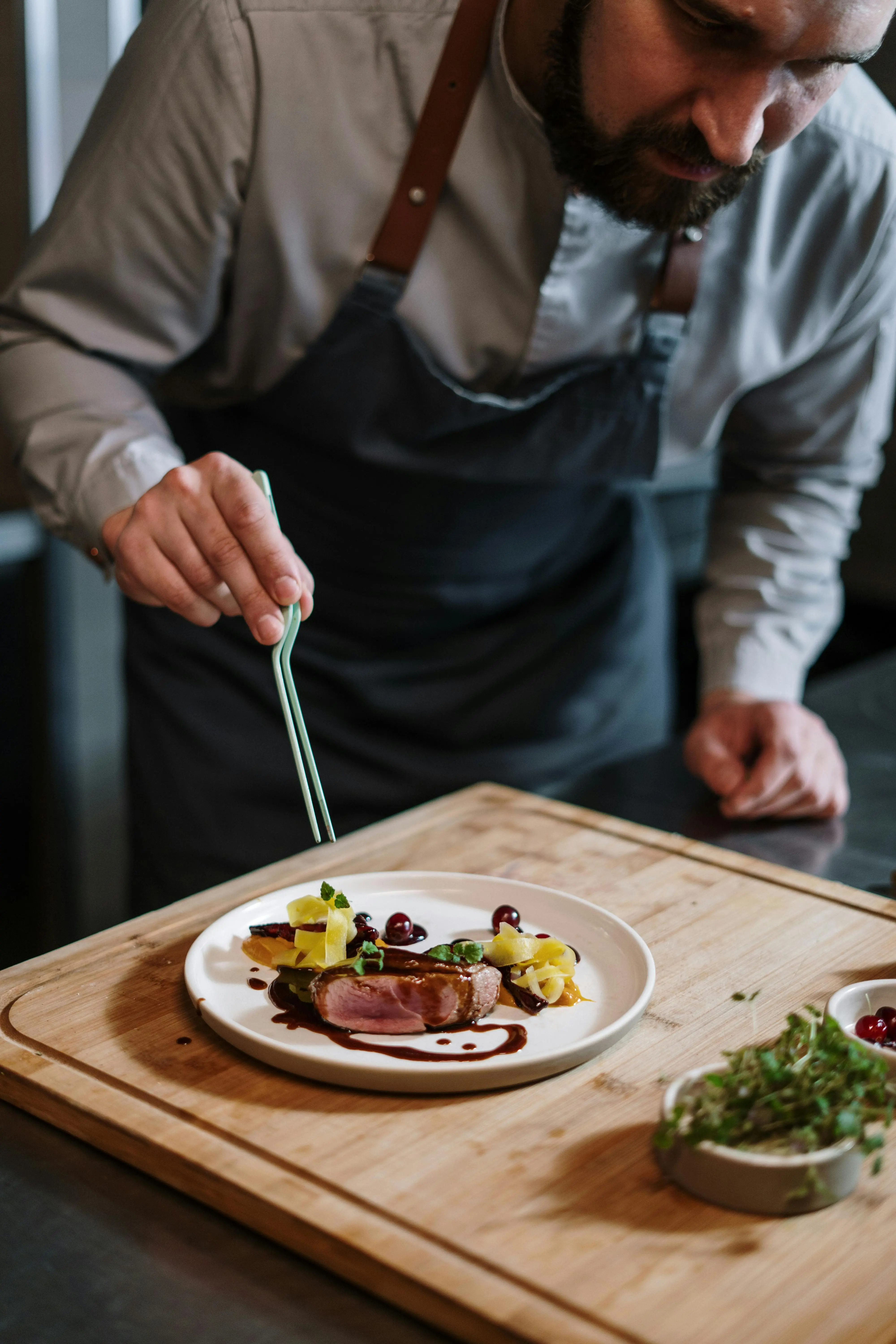 A man preparing a dish.