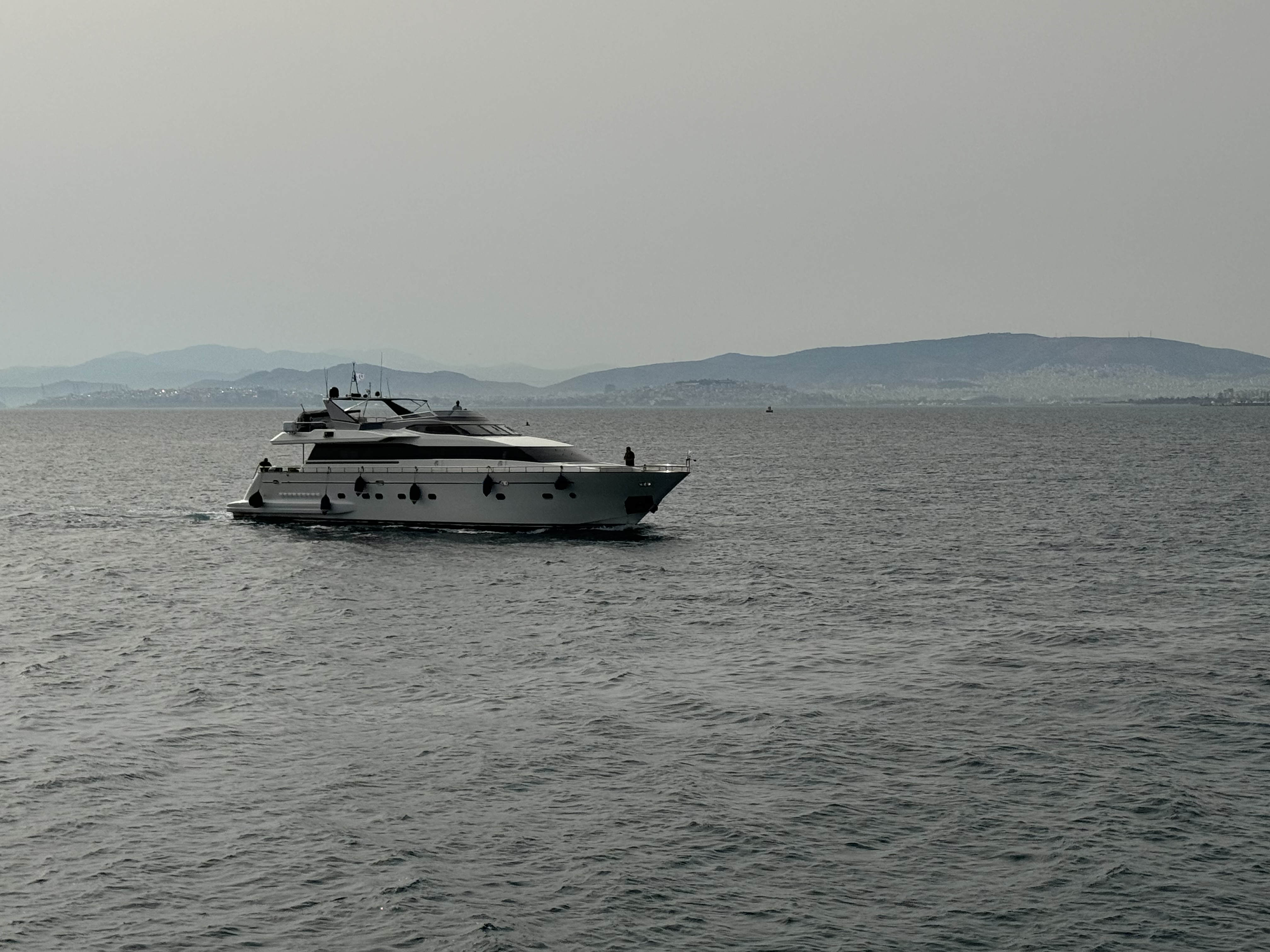 An aerial view of a white yacht.