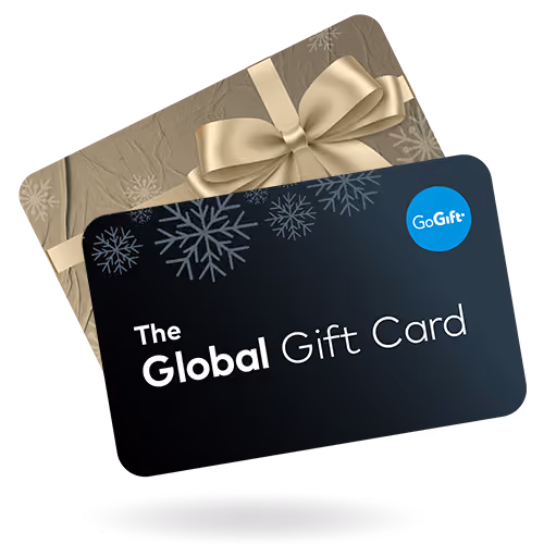 The Global Gift Card box wrapped like a Christmas present with a gold ribbon and snowflake pattern