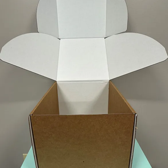 Regular insulated foil liner opened inside a kraft corrugated shipping.