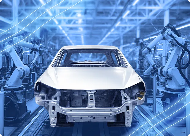 Automotive body moving through an assembly line with robotic arms positioned on both sides of the production cell.