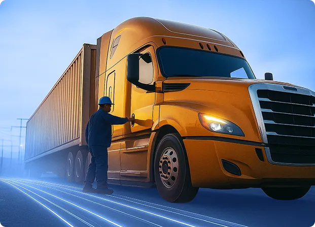 Truck driver standing beside a freight truck during a transportation operation.