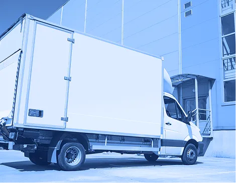 Refrigerated truck parked at a distribution facility prepared for temperature-controlled transport.