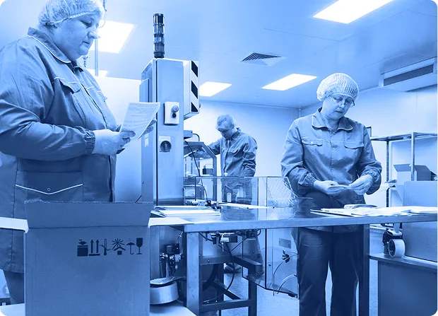 Automated production line with robotic equipment assembling vehicle components.