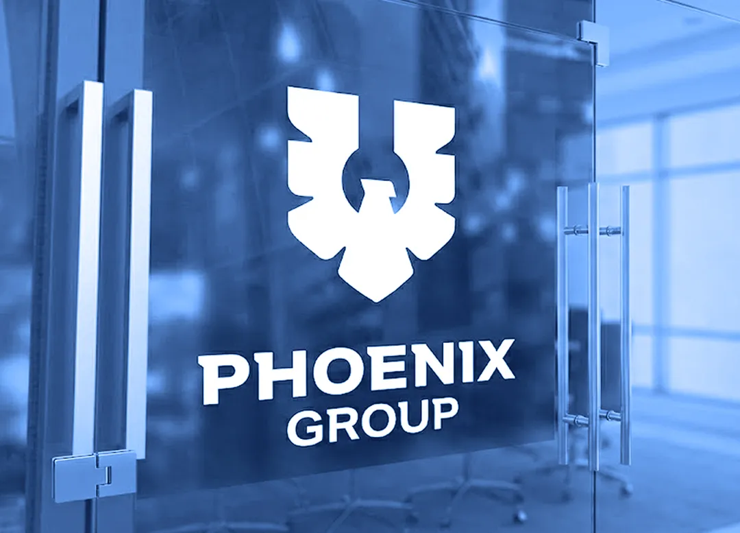 Phoenix Group logo displayed on a glass office wall inside a corporate workspace.