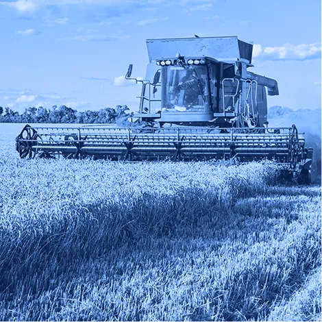 Combine harvester operating in a field during agricultural harvesting.