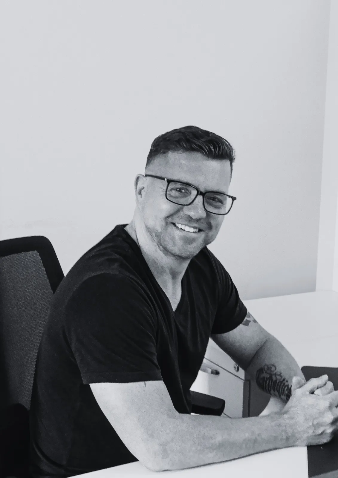 ACS employee man smiling at screen