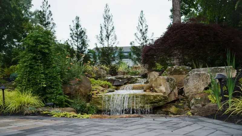 A backyard landscape waterfall