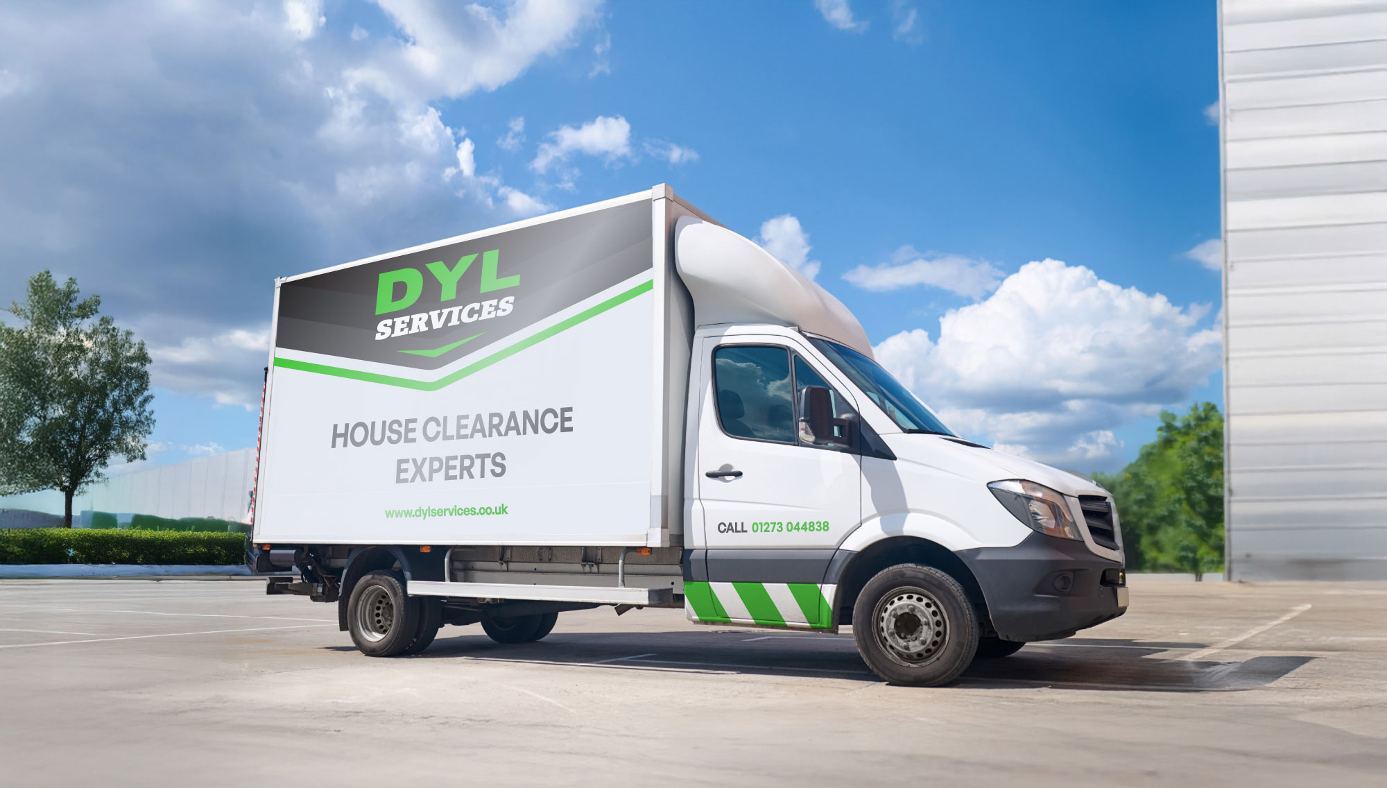 A white delivery truck in a parking lot displays "DYL Services House Clearance Experts" on the side.