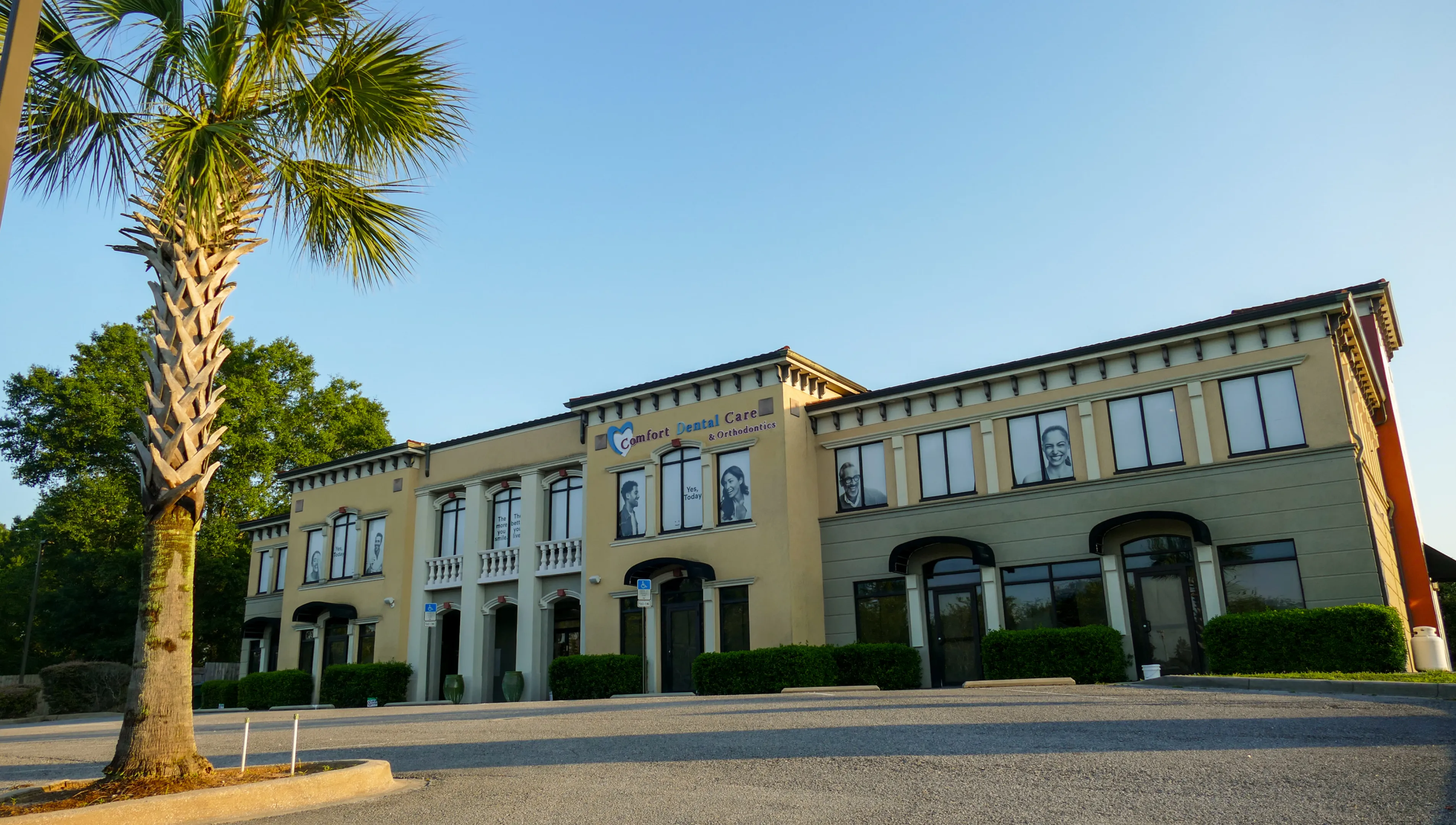 Bright children's waiting room with chairs, toys, and space-themed decorations on the walls and ceiling.
