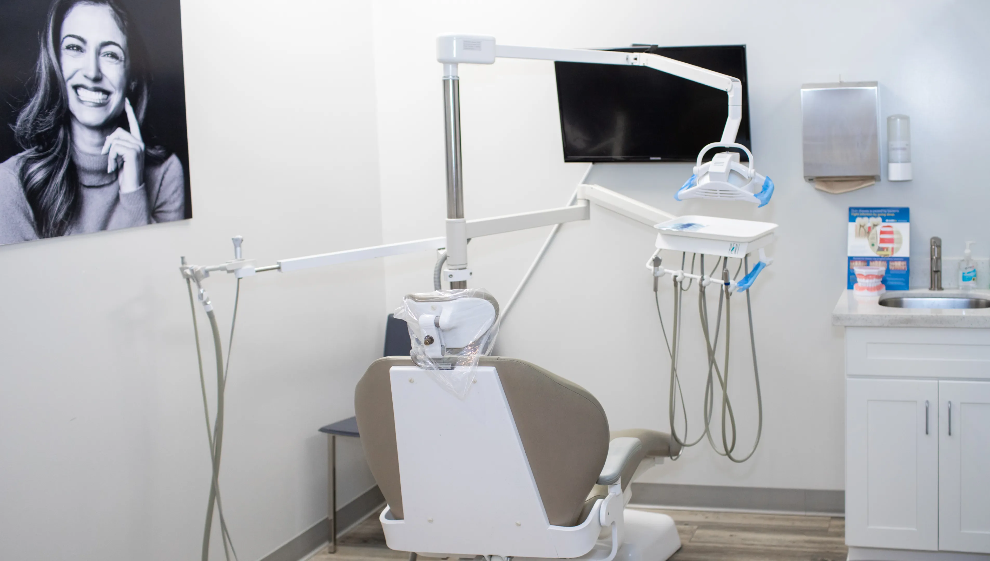 A dental examination chair and tools in a clean, modern dental office.