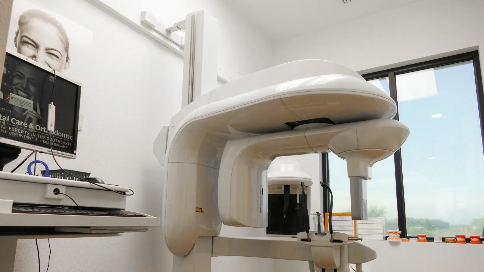 Elevator door opens to reveal a poster of a smiling woman with "Elevated Dental Care" text.