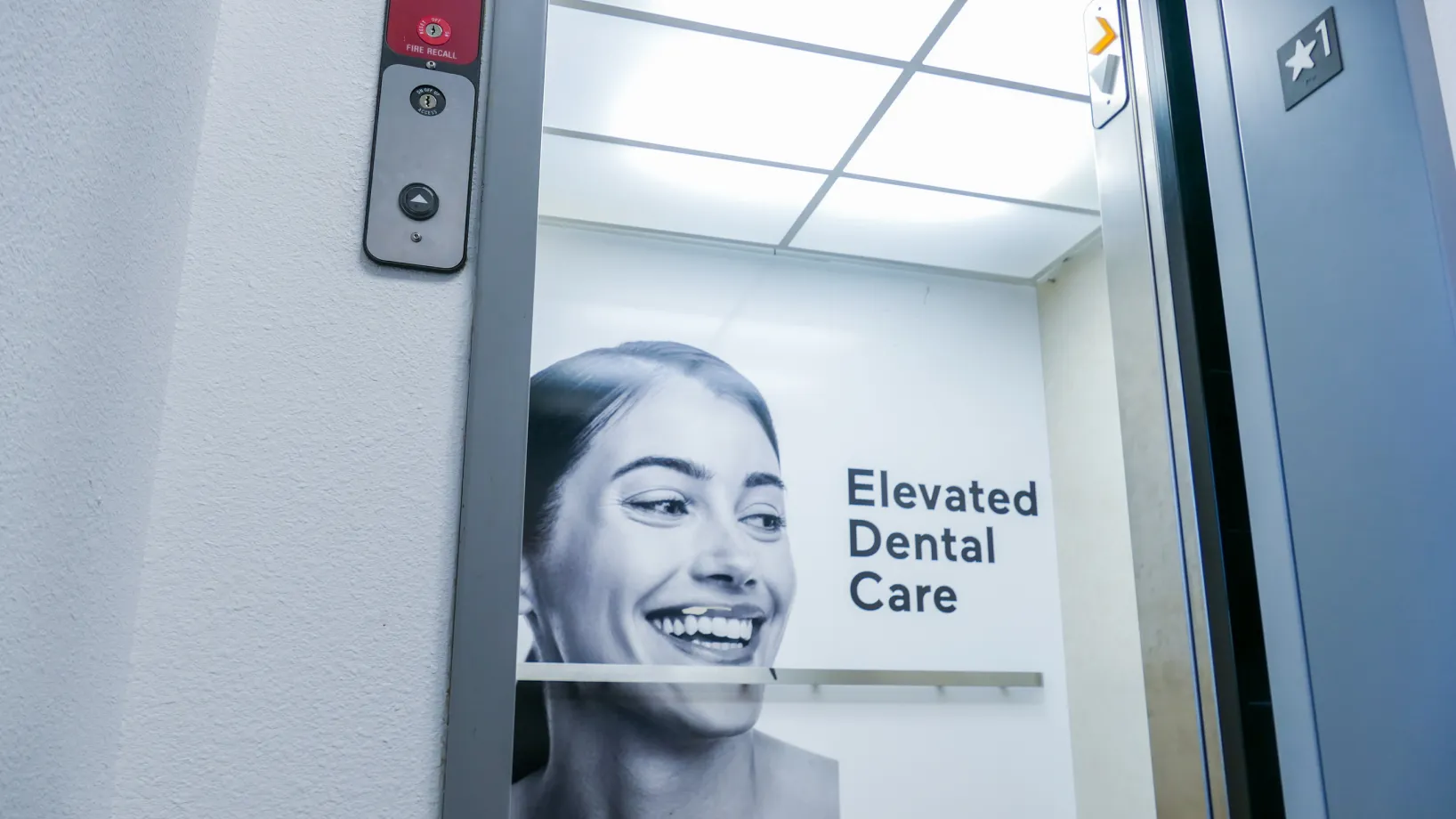 Reception desk in a modern office with space-themed drawings on the front panel.