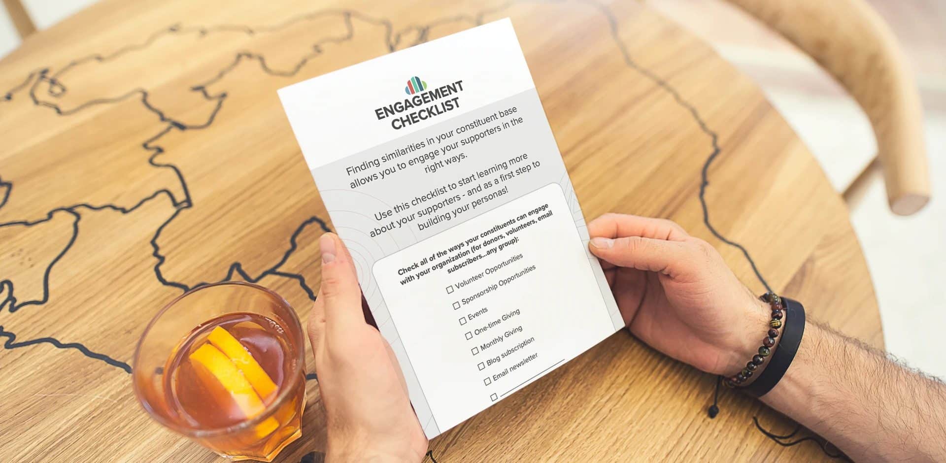 person holding copy of donor engagement checklist