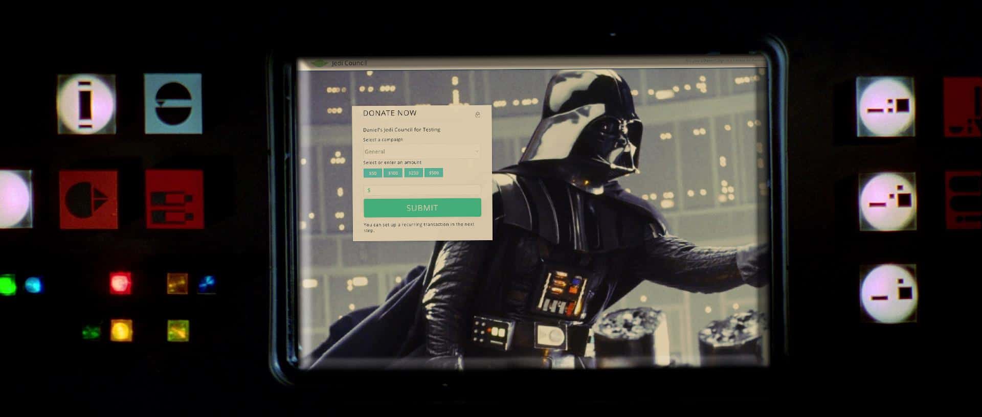 View of Darth Vader on a screen with a donation form overlay and colored control panel lights around it.