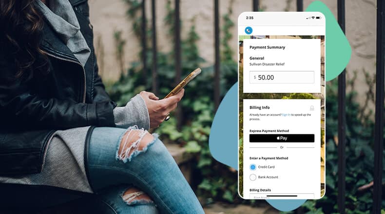 Person using a smartphone showing a payment app screen with $50 payment and payment method options.