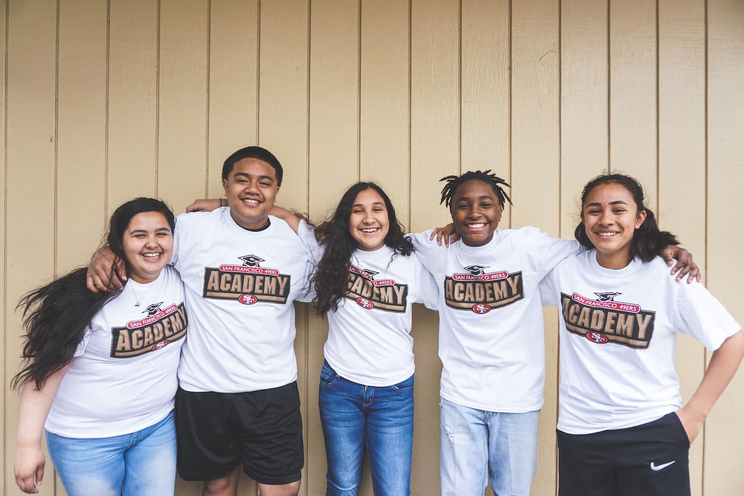 Constituents of San Francisco 49ers Academy gathering together