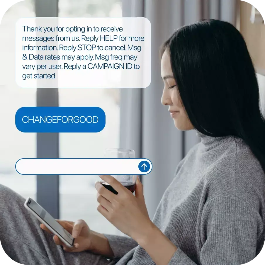 Woman sending a donation via SMS with Donorbox’s text-to-donate interface overlaid