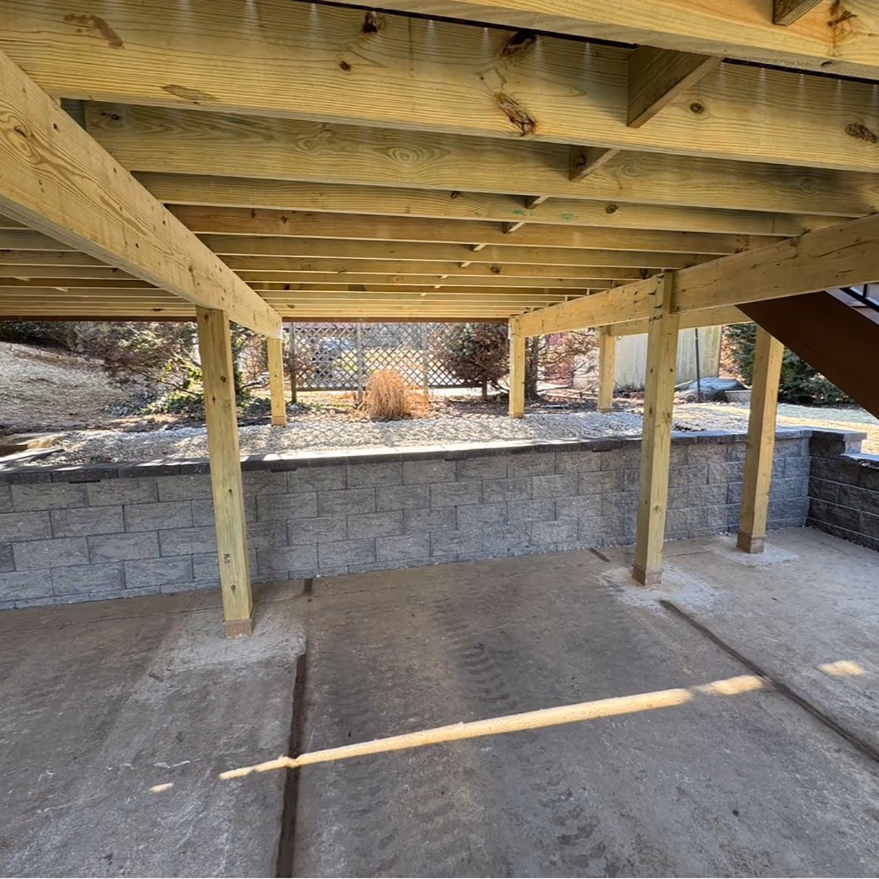 Retaining wall construction for outdoor space stability