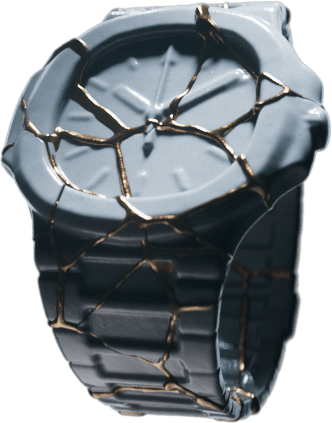 Broken gray wristwatch with gold cracks repaired in a kintsugi style.