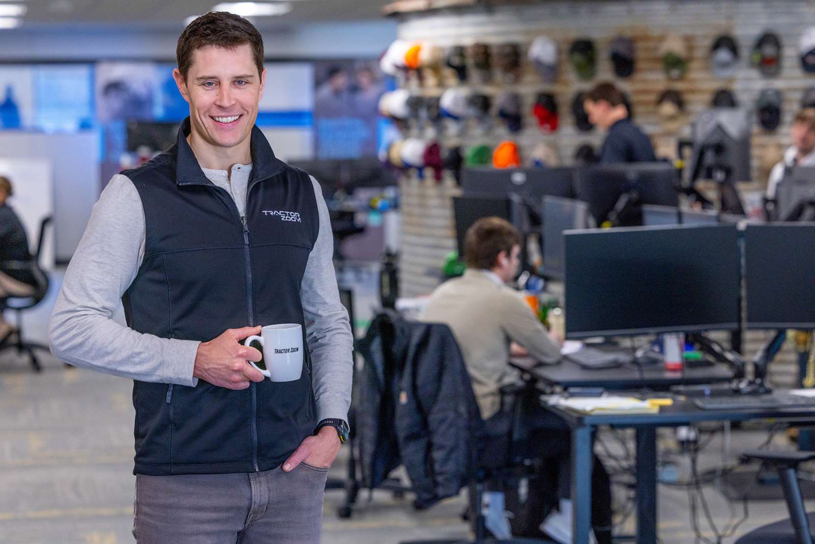 Kyle McMahon, founder and CEO of Tractor Zoom, stands in the office at Tractor Zoom headquarters in West Des Moines.