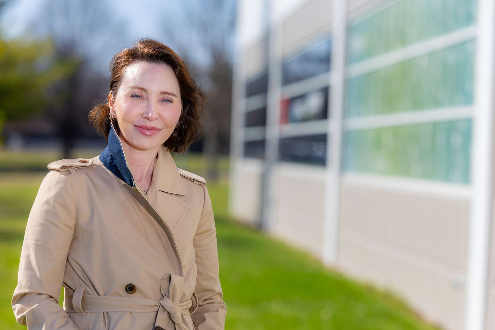 Karri Haen Whitmer stands outside the Ama AI office at ISU Research Park.