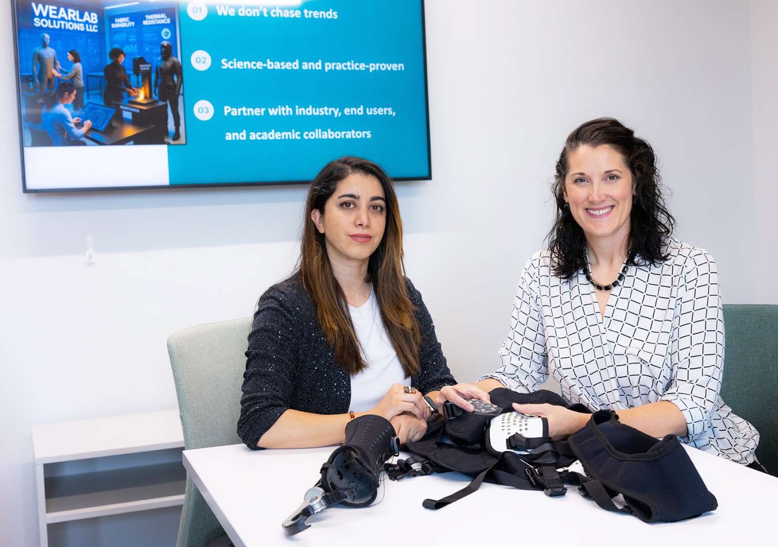 Bahar Hashemian Esfahani (left) and Rachel Eike display their Dual-Y Nexxus™ harness on April 8, 2026, at the Student Innovation Center at Iowa State University. Photo by Christopher Gannon/Iowa State University.