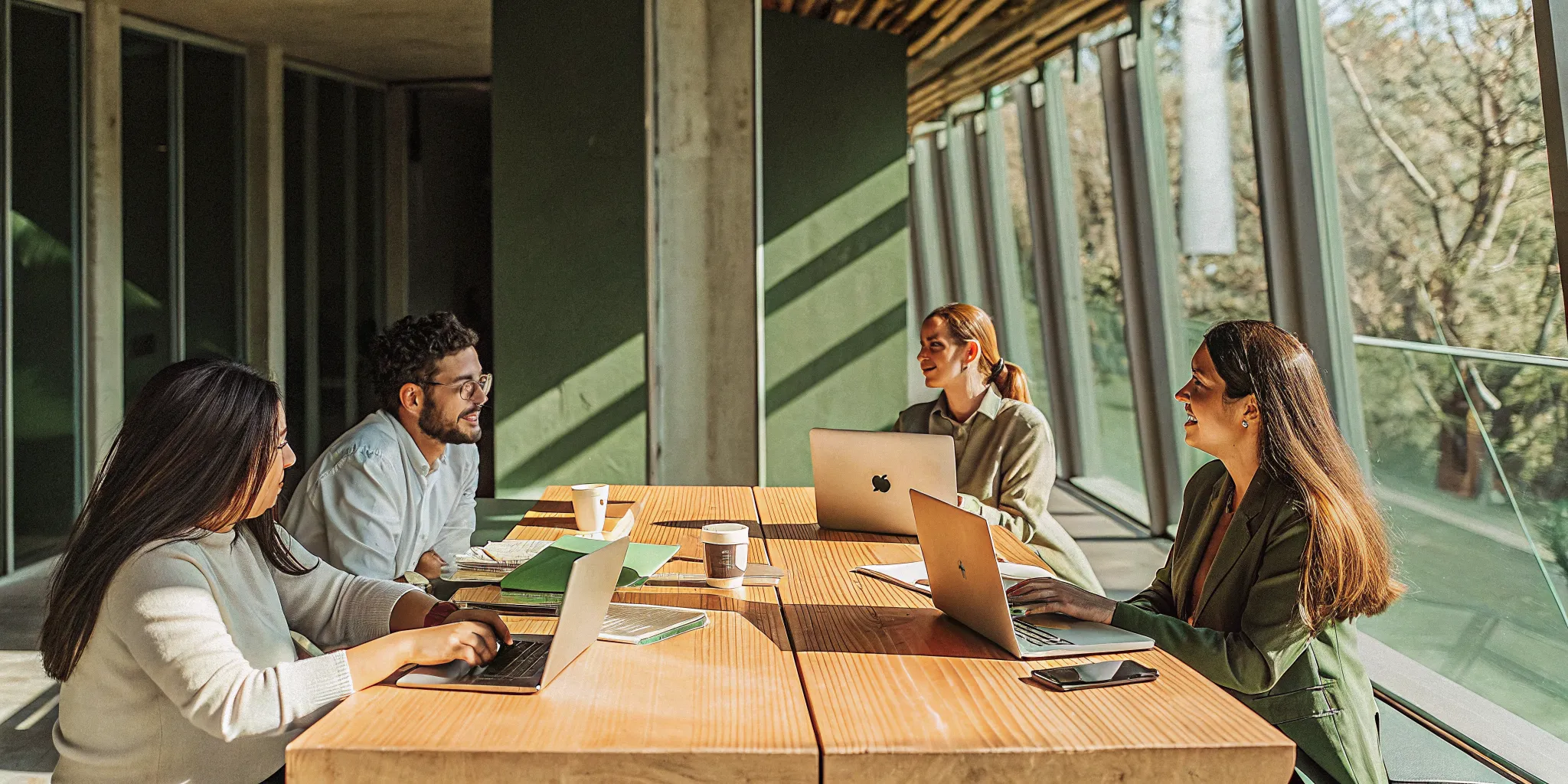 A motivated team collaborating during a positive meeting to discuss new ideas.