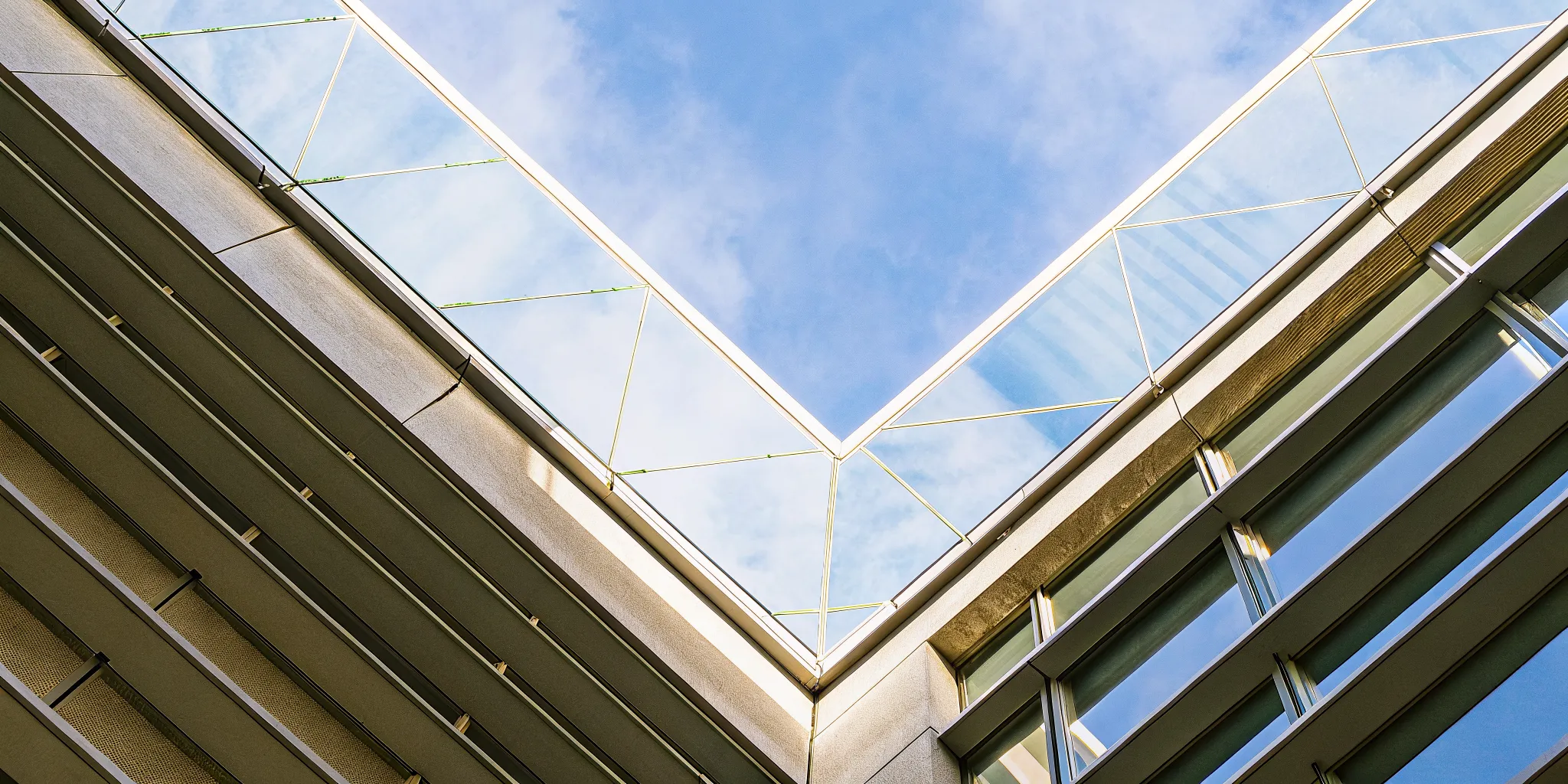 Modern glass building structure for a PPT on building and leading high performance teams.