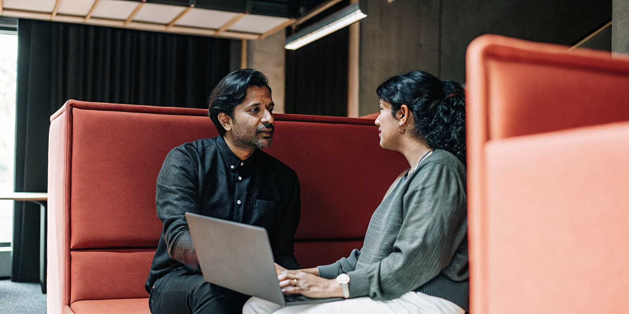 One-on-one coaching conversation between a manager and teammate