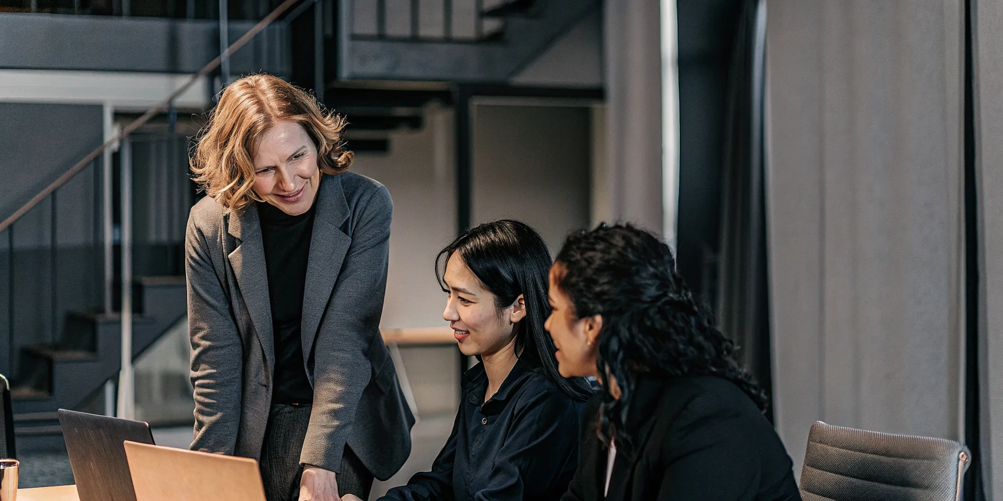 Middle manager practicing team coaching during a work discussion