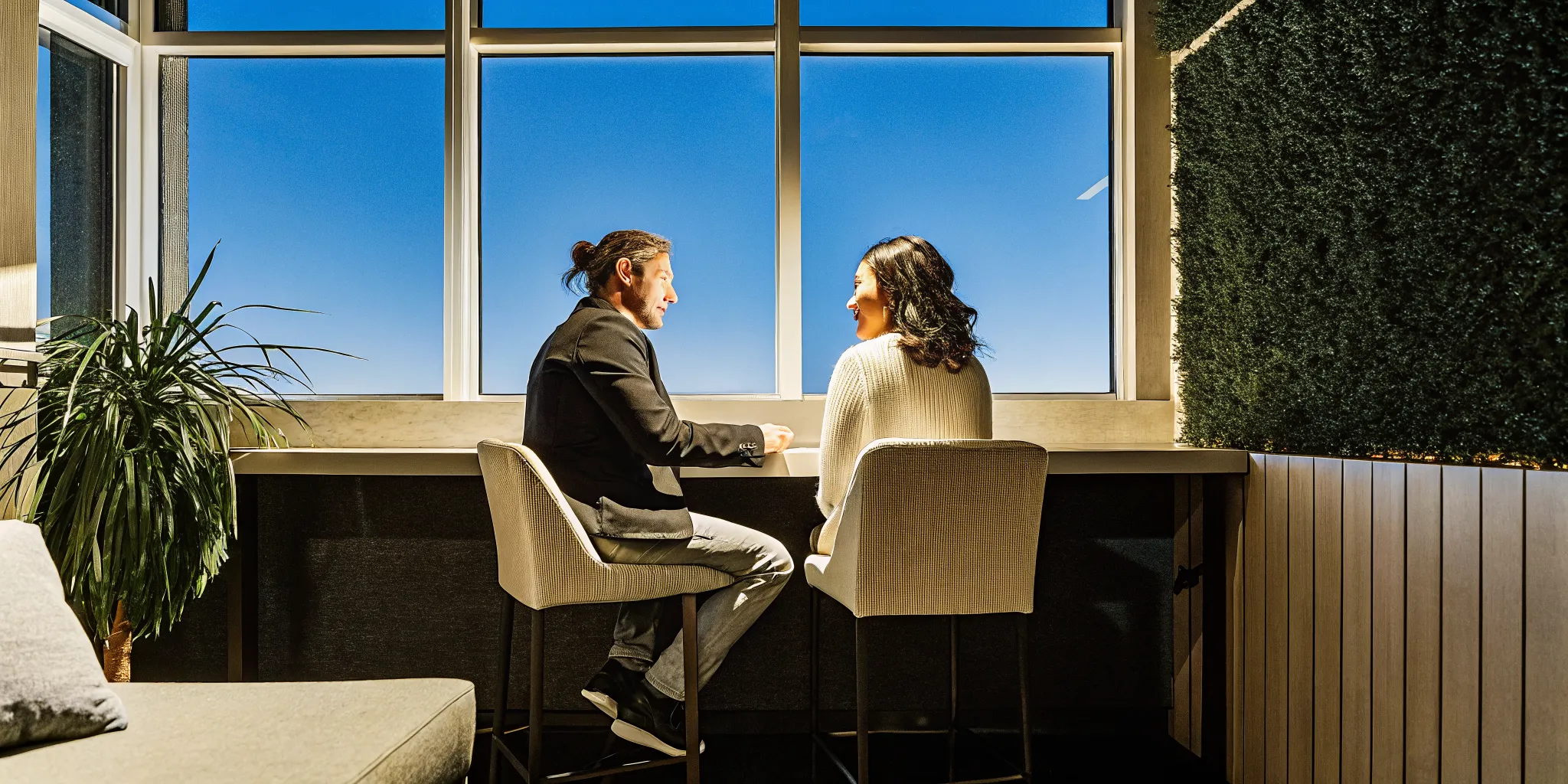 A business manager having a positive one-on-one coaching conversation with a team member