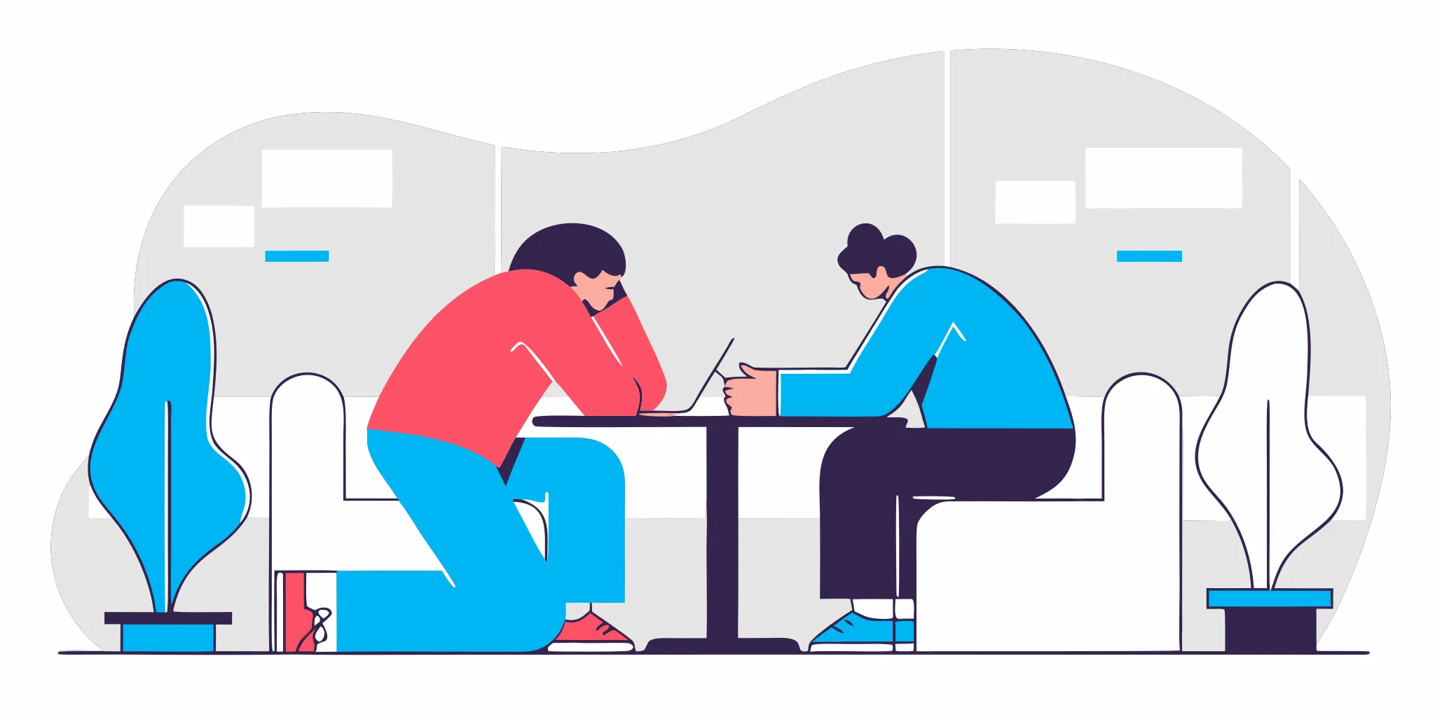 A manager and a direct report having a focused one-on-one conversation at a table in a bright modern office