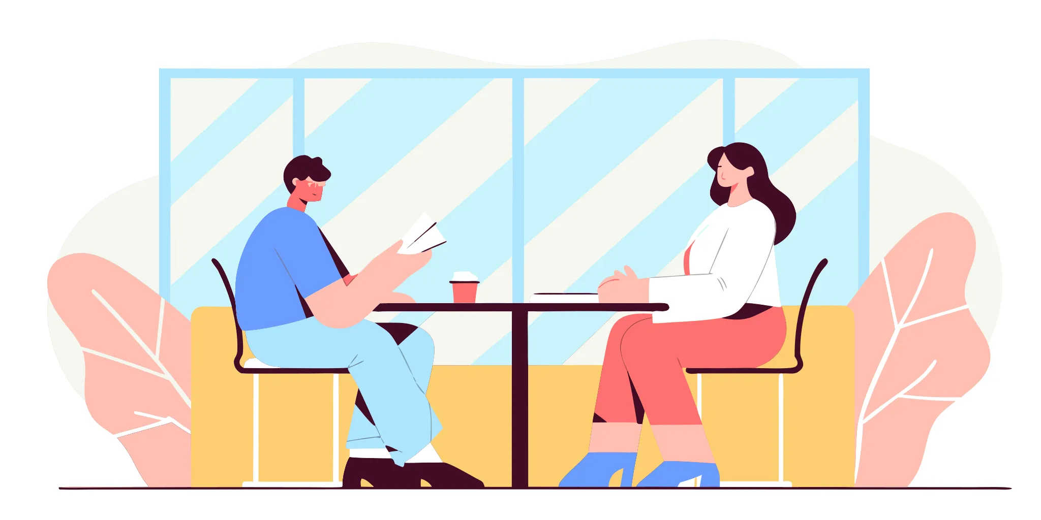 A manager and direct report holding a calm one-on-one meeting at a table in a bright modern office