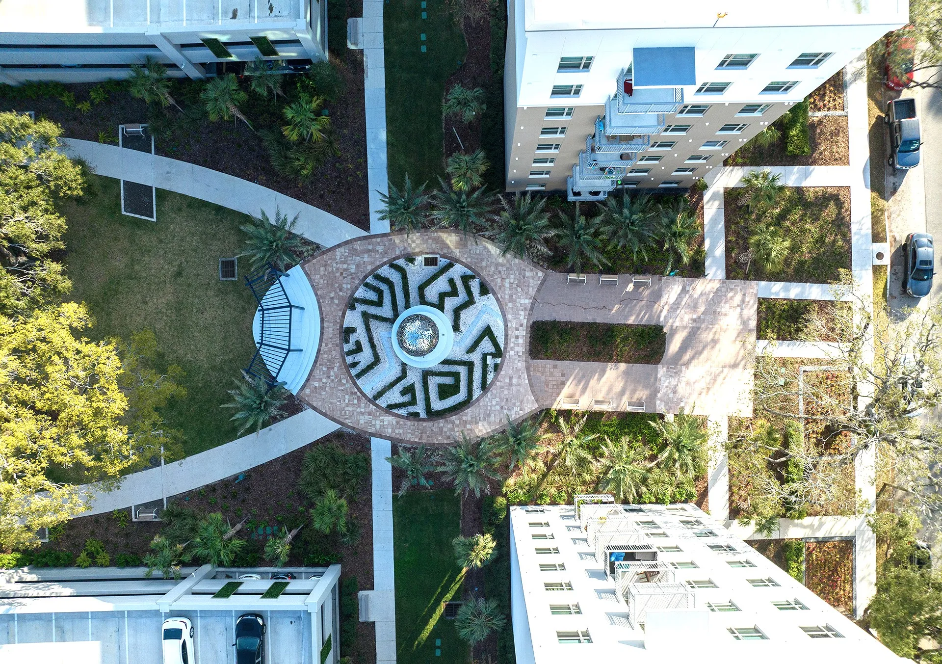 drone shot of exterior walking paths and statue