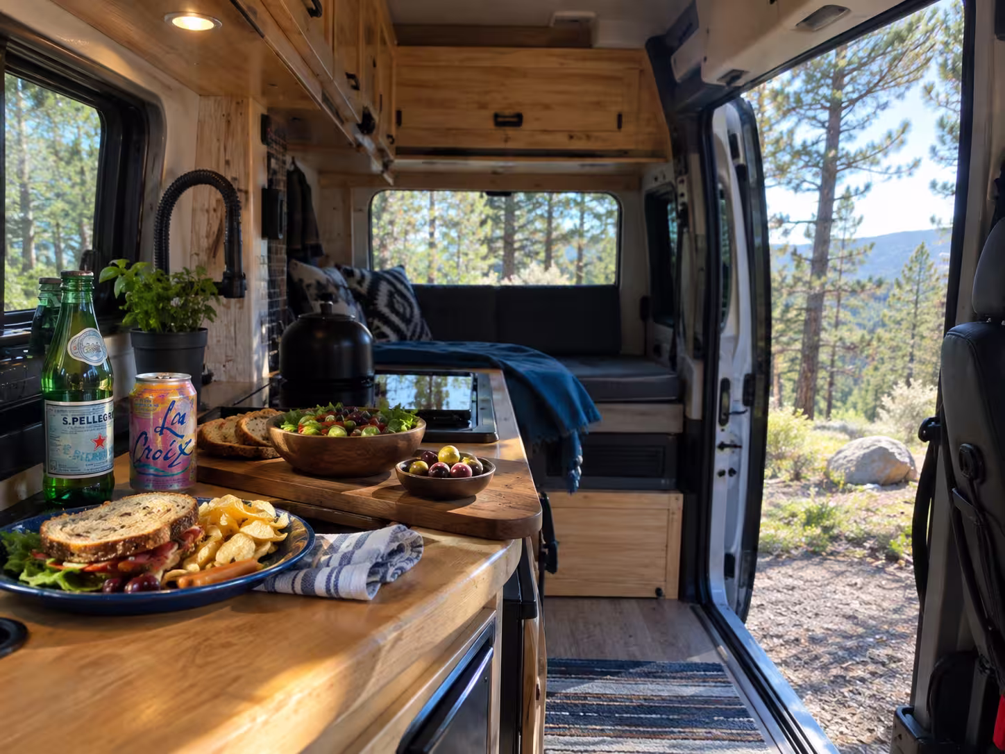 Camper van galley set up for a meal before a Renaissance Festival day