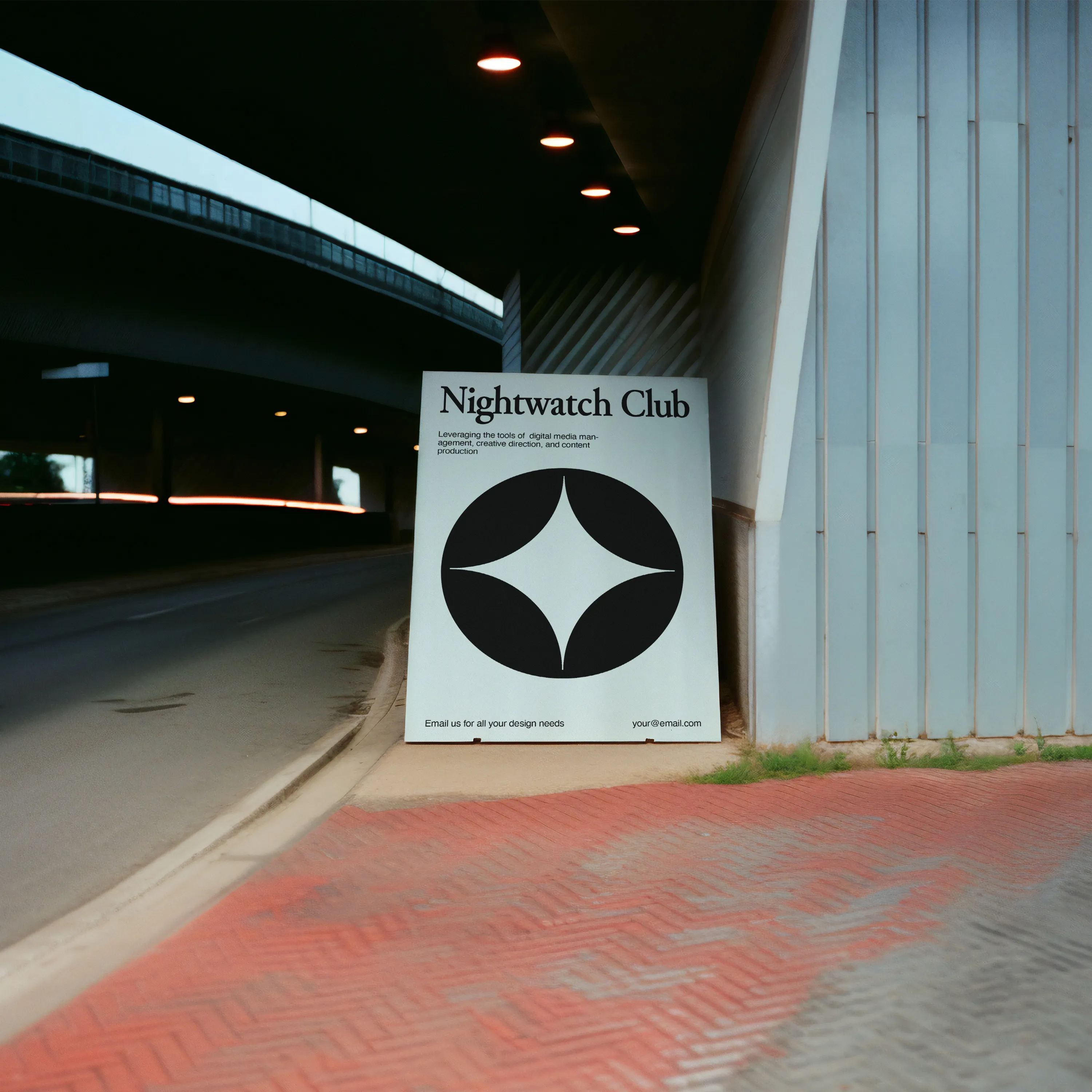 Large poster on display under a tunnel