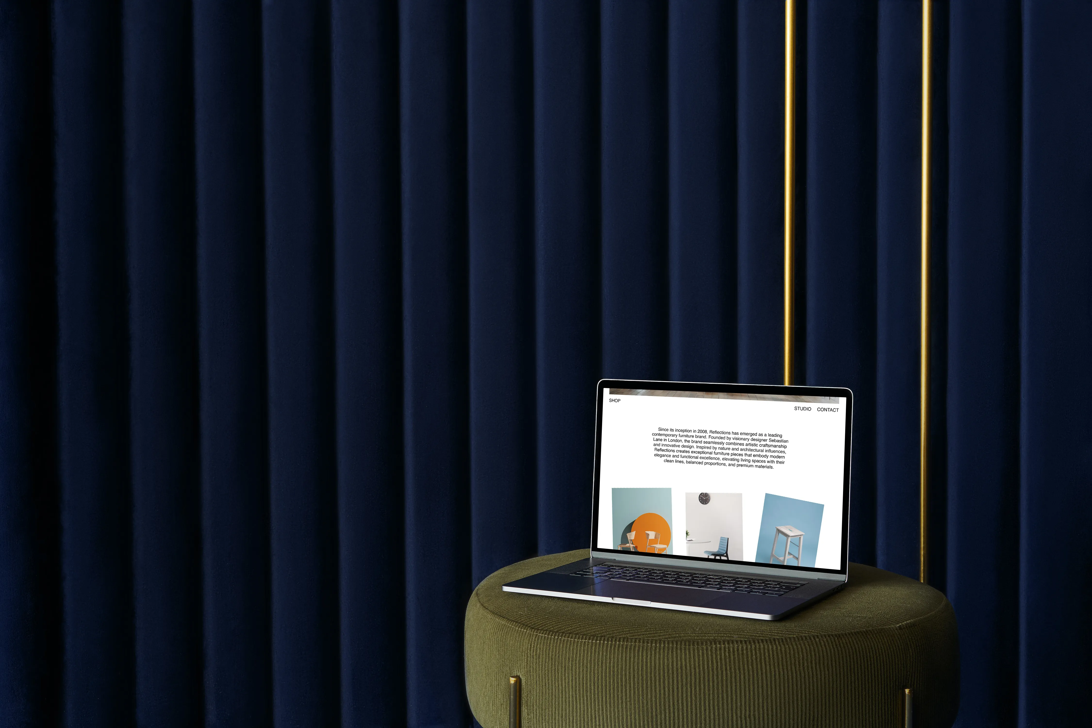 a laptop resting on a chair displaying the refelctions website 