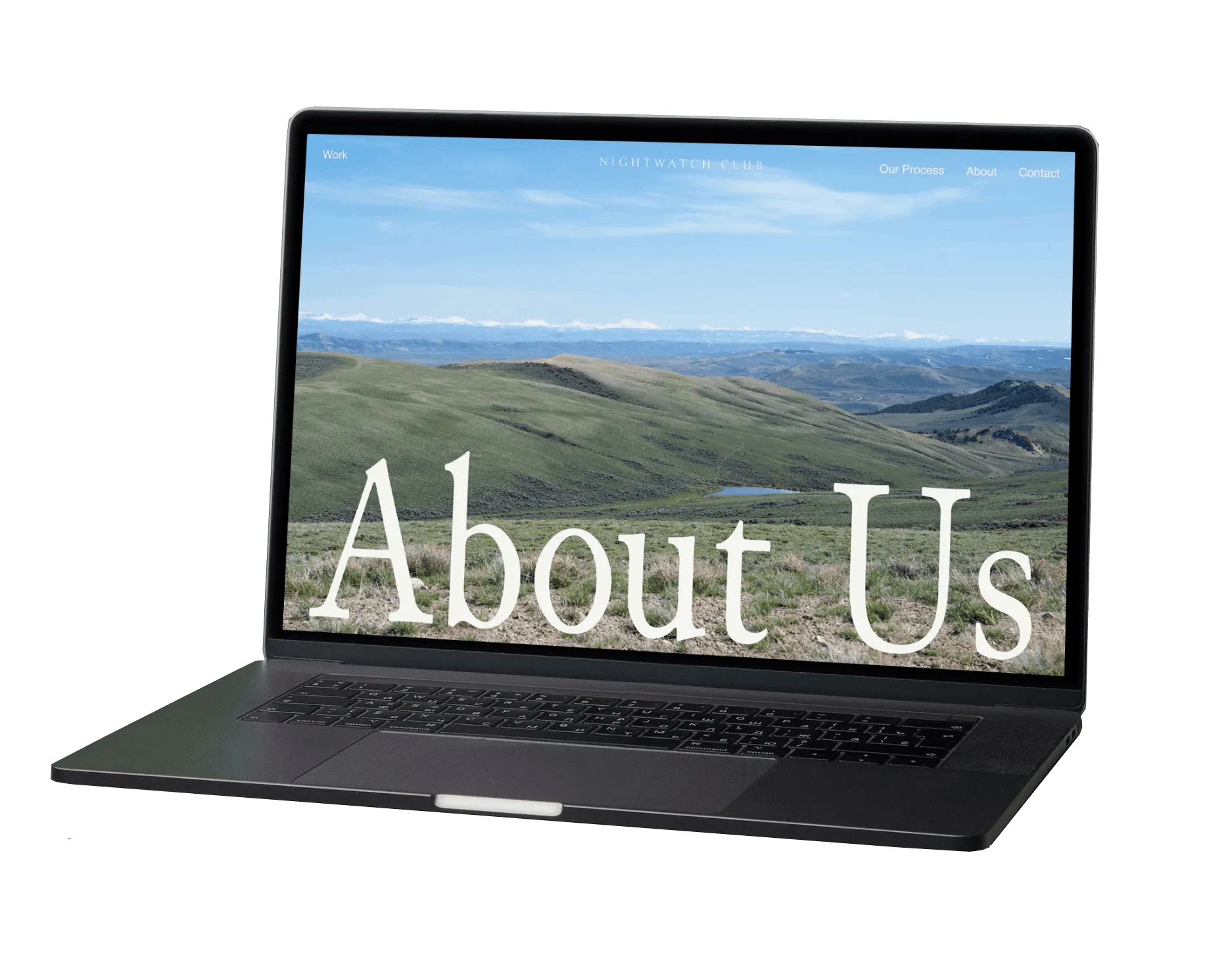 A laptop resting on a green sofa displaying the nightwatch website